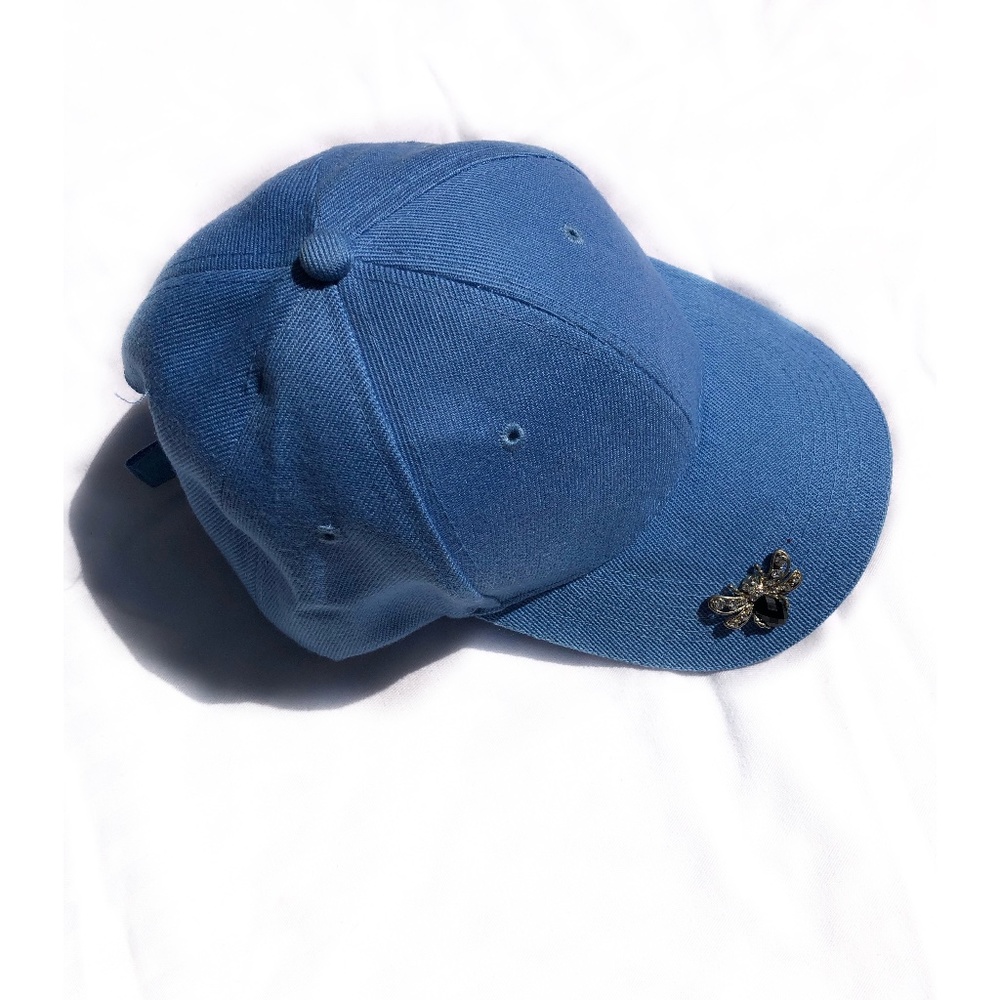 Blue baseball cap with brooch